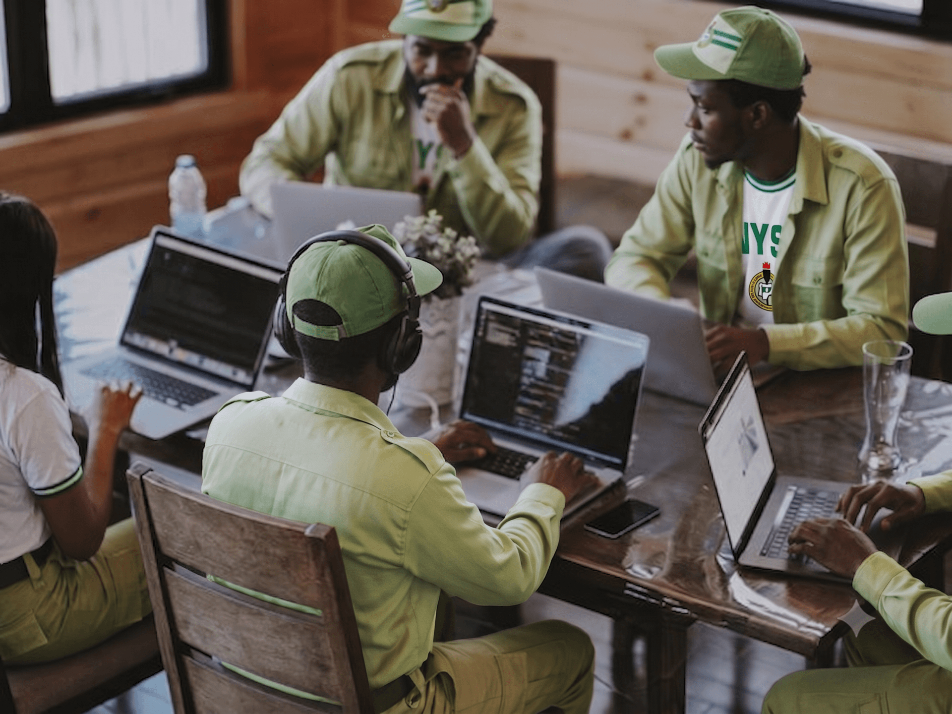 NYSC members collaborating on a project